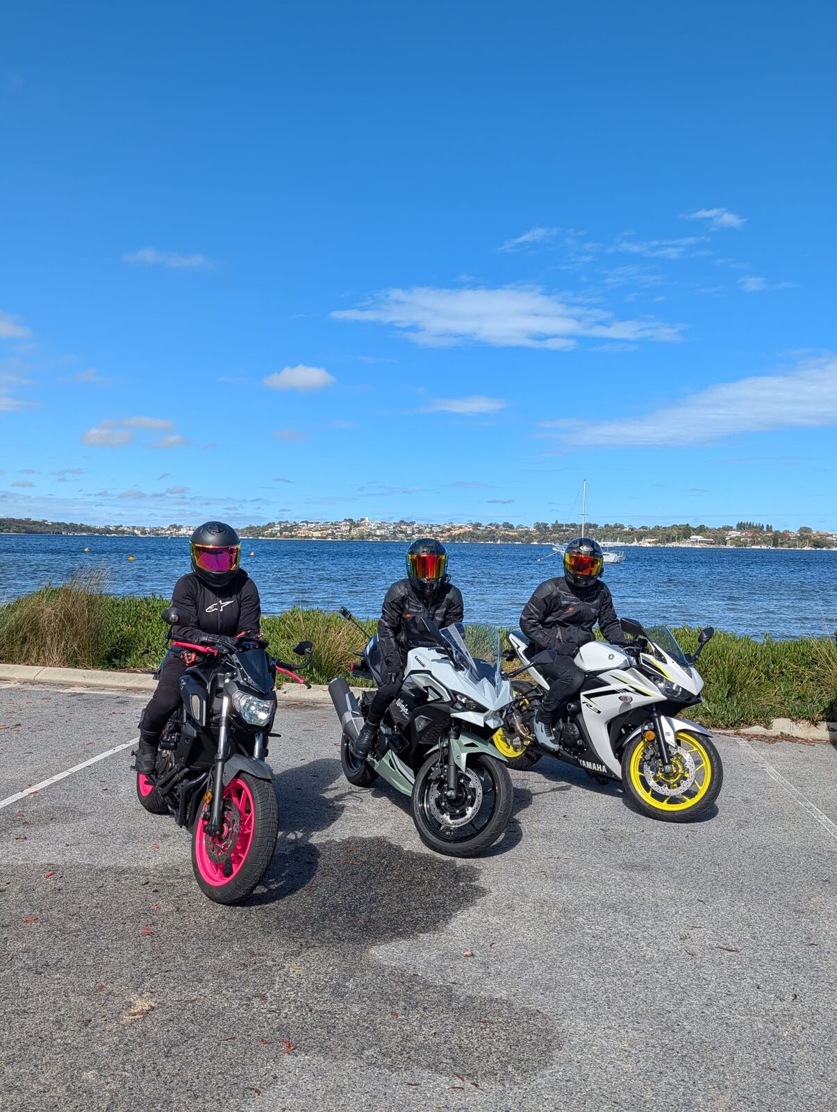 Group of riders beside the river